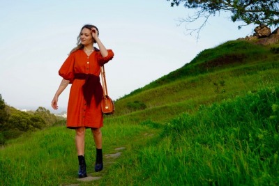 Photo of model in red dress.